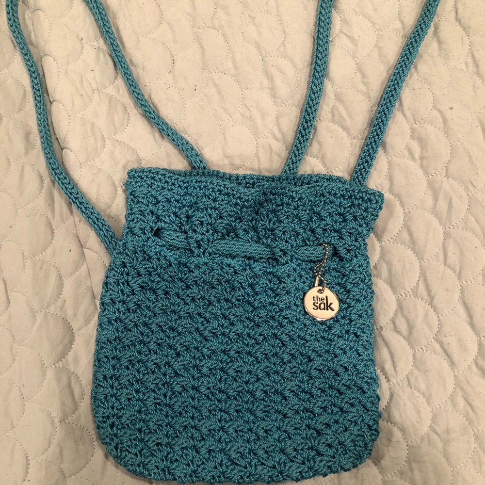 The Sak blue hand crocheted small backpack/purse